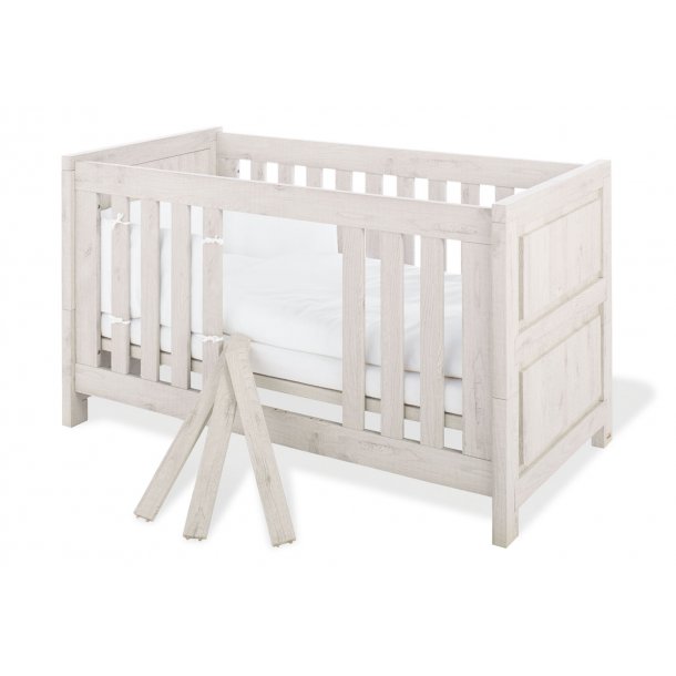 grey cot bed and changing table